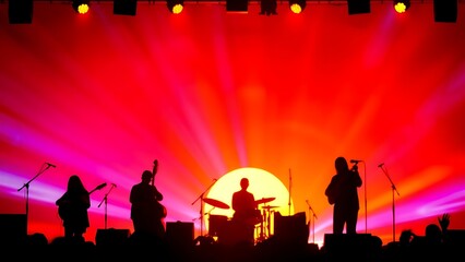 Artistic composition of musical instrument silhouettes against a vibrant sunset-colored backdrop.