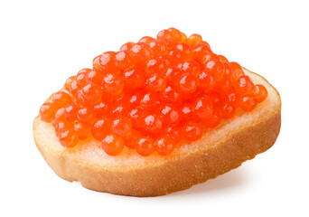 Red caviar on a piece of bread close-up on a white. Isolated