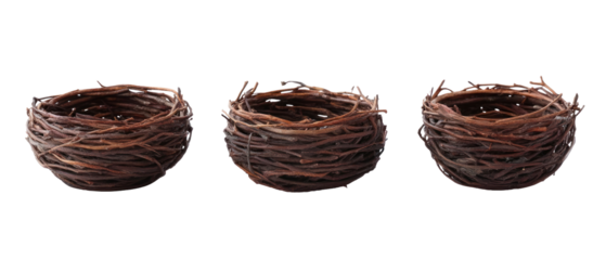 Three Detailed Brown Woven Bird Nests Isolated Against Black Background with Textured Appearance