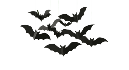 Spooky flock of black paper bats suspended mid-air creating a dramatic Halloween atmosphere for festive decorating