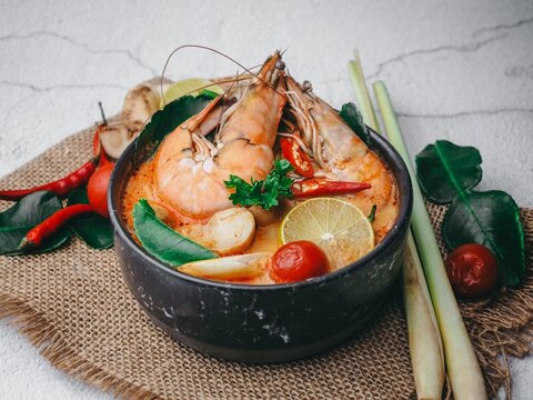Spicy Thai soup Tom Yam with Ingredients.
Thai soup Tom Yam Kung or Tom Yum with mushrooms and shrimp. Tom Yum Goong spicy soup traditional food cuisine.