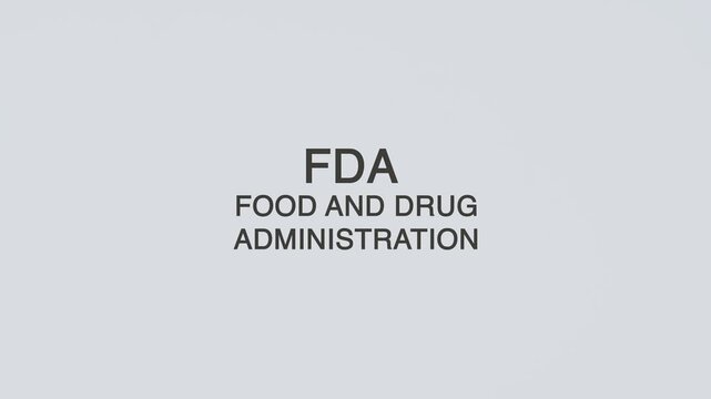FDA - Food and Drug Administration word diagnosed with a stethoscope held in hand on a white background, illustrating regulatory authority, medical oversight, healthcare concept, and awareness