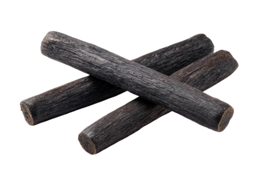 Dark, cylindrical wooden sticks, crossed