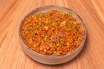 Airport chaufa in its classic form: a layer of fried rice, a mixture of meats and egg, all topped with a thin omelet-style tortilla