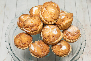 Vanilla muffins with a glossy raspberry jam and poppy seed glaze
