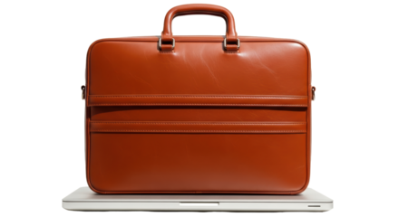 Isolated leather briefcase on laptop