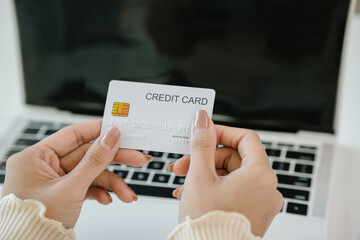 A businesswoman uses her laptop for online banking and e-commerce, managing payments, shopping, and financial transactions in cyberspace, reflecting modern technology, digital security, investment, an