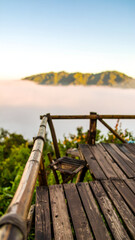 Misty Mountain View from Wooden Deck at Sunrise