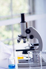 Vertical Horizon Science laboratory chemistry test science lab with microscope glass tubes on white table scientific background. Vertical Colorful Liquid biology scientist laboratory chemical