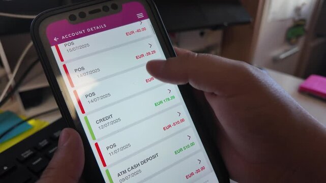 Mobile banking. Person scrolling through the transactions. Close up on the phone.