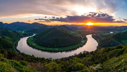 Panoramic sunset over a meandering river valley