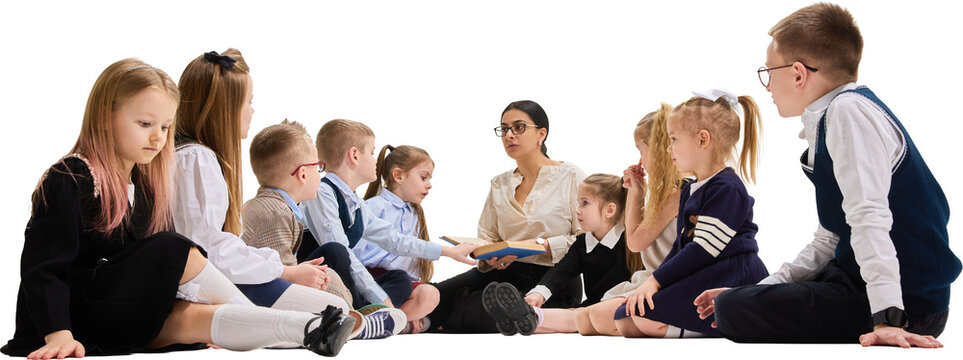 Children sitting with teacher during book reading activity on transparent background. Concept of school education, teamwork, listening skills, and collaborative classroom learning.