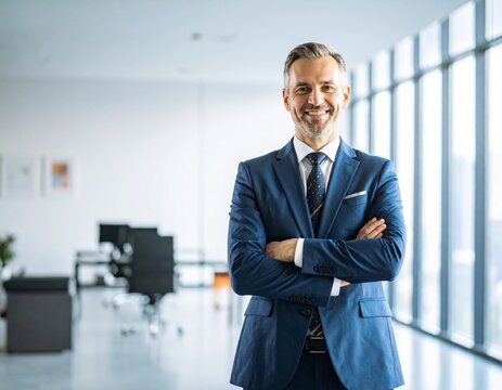 Confident Executive: A distinguished and confident business person radiates an aura of success, with a poised posture and warm smile in a modern office setting, embodying professional elegance.