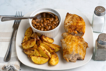 seasoned chicken thighs  with potato wedges