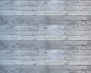 A seamless exposed concrete surface with a distinctly rough, irregular texture.