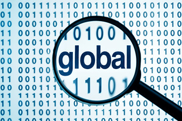 Magnifying glass over binary code revealing the word global digital