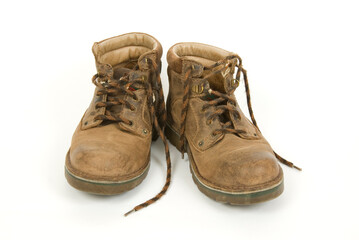 Pair of old desert boots isolated on white background.