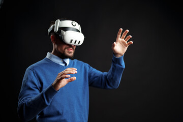 Immersive virtual reality experience with man wearing VR headset in a dark environment