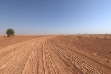 Desert road stretches into the hazy distance