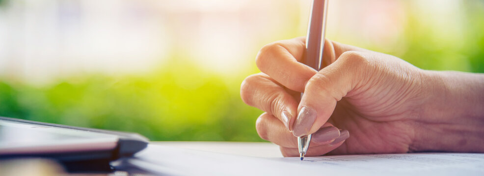 Banner Businesswoman hands note meeting document in conference room. Woman Hands writing planning on notebook. Female hand holding pencil write on diary sketchbook. Business Planning with copy space - Powered by Adobe
