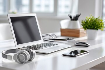 Contemporary tidy home office desk with laptop, headphones, and phone.