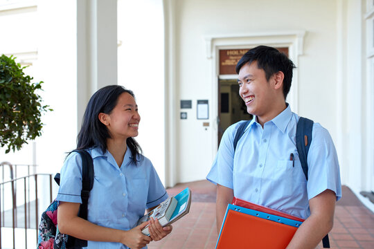High School students laughing together on-campus