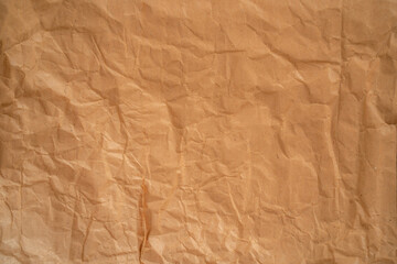 Recycle brown paper texture. Background with soft wrinkles on the surface.
