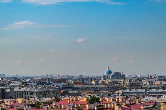 A view from above of the panorama of Saint Petersburg, with the blue domes of the Izmailovsky Cathedral in the distance.