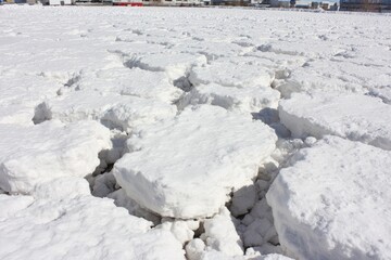 Broken ice floes on frozen water