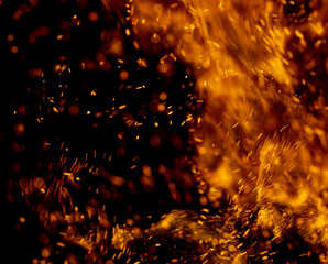 A fire is burning and the smoke is creating a blurry background