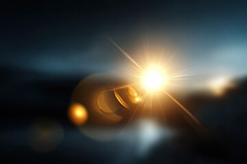 Bright light source, lens flare, dark background