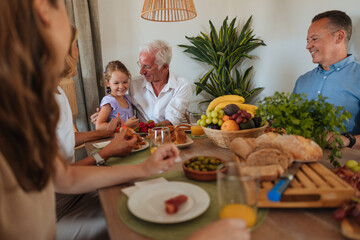 Family enjoying breakfast together at home