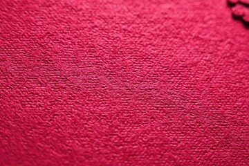 Close-up view of a deep crimson textured surface