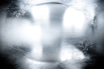 Abstract, metallic, frosted surface with reflective highlights