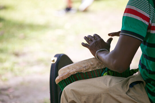African musician playing drums