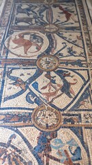 Obraz premium Ancient mosaic floor design with animal figures and geometric patterns
