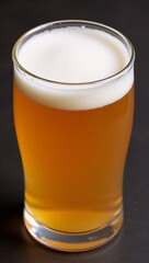 Ok frothy golden beer served in a glass ideal for social occasions