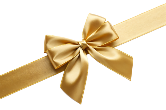 A close up of a gold ribbon tied in a bow isolated against a black background in a diagonal angle