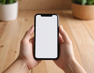Smartphone held in hands on a wooden table