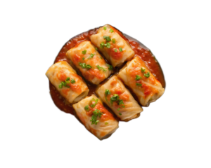 Cabbage rolls in tomato sauce with green garnish arranged on a black background top down view shot