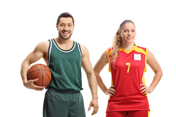 Male and female basketball players posing together