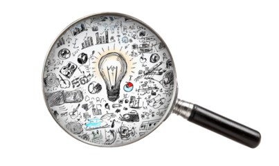 Magnifying glass over sketches, lightbulb central