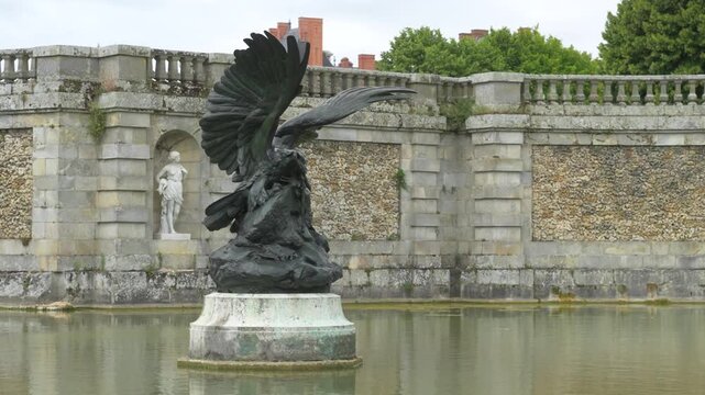 Classic French fountain in a castle moat