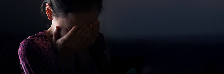 Sad Child Covering Face in Wide Banner with Copy Space