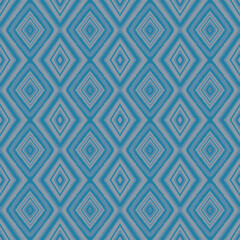 Seamless ikat diamond pattern in blue and white. Geometric ethnic design perfect for fabric, textile print, wallpaper, wrapping paper, background, and modern home decor.
