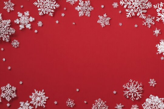 Christmas snowflakes frame on vibrant red background