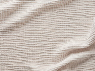 Muslin fabric texture. Background of light gray muslin fabric. Cream color muslin background close up. Design element.