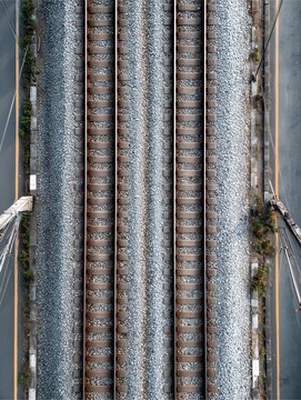 Railway Track Aerial View: An eye-level perspective showcases the repetitive nature of railway tracks, offering an abstract exploration of movement and journey. The image is a modern expression