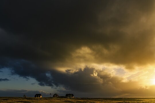 Dune landscape with storm clouds and houses, List-ost, Ellenbogen, List, Sylt Island, Germany