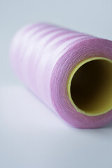 Coil of pink color with white background